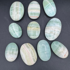 Banded Pistachio Calcite Palm Stones - Sold By Piece