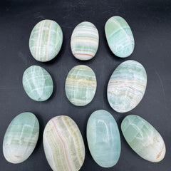 Banded Pistachio Calcite Palm Stones - Sold By Piece