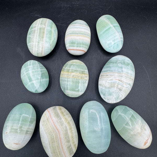 Banded Pistachio Calcite Palm Stones - Sold By Piece
